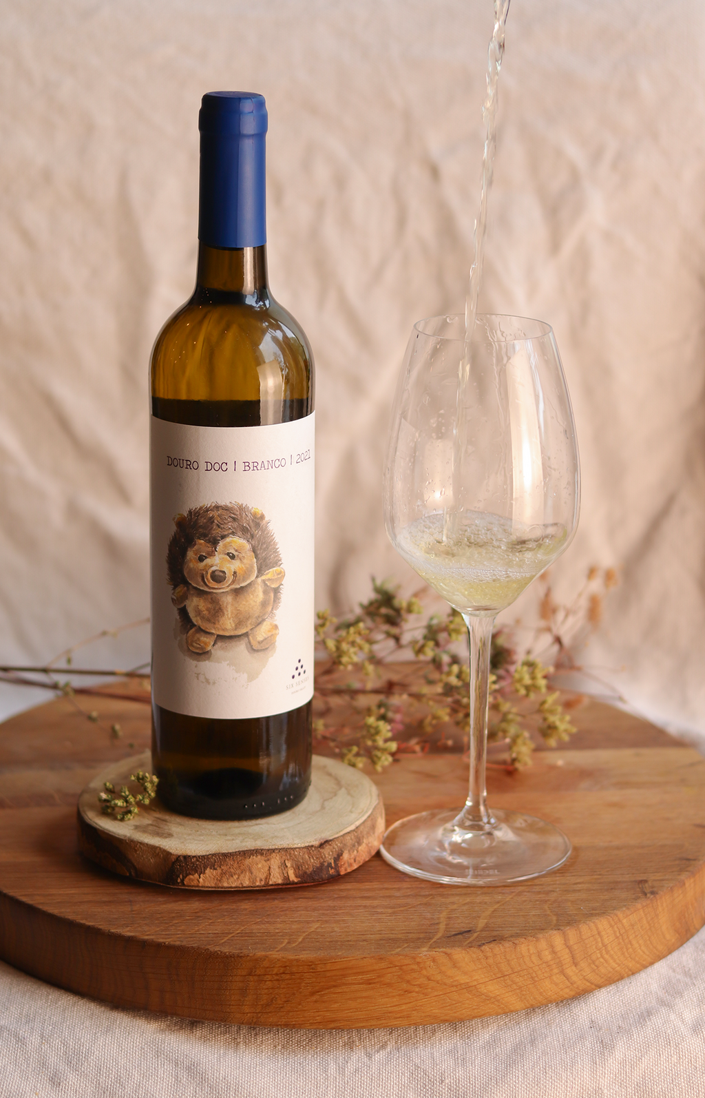 Bottle of Doc white wine from Six Senses, with an illustration of a hedgehog on the label 